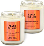 Vela White Barn Peach Bellini con una única mecha para ambientar la habitación y aroma duradero.