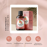 White Naturals Aceite Esencial Pomelo, ampolla con gota para uso aromático diario.