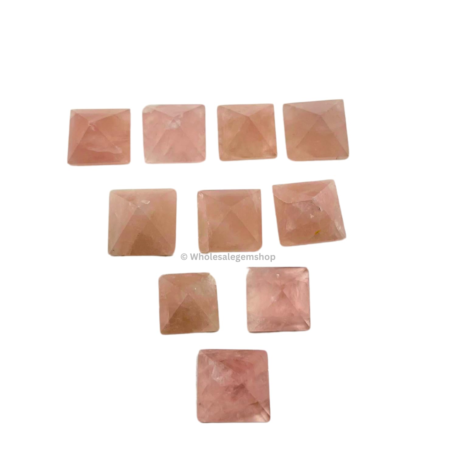 Pieza de cuarzo rosa con acabado brillante y bolsa de terciopelo.