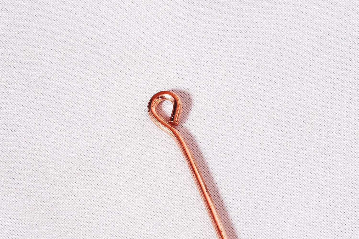 Diseño ergonómico del raspador de lengua Wonder Care para uso diario.