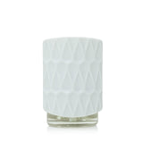 Sensor de luz en Yankee Candle ScentPlug ajustando la intensidad.