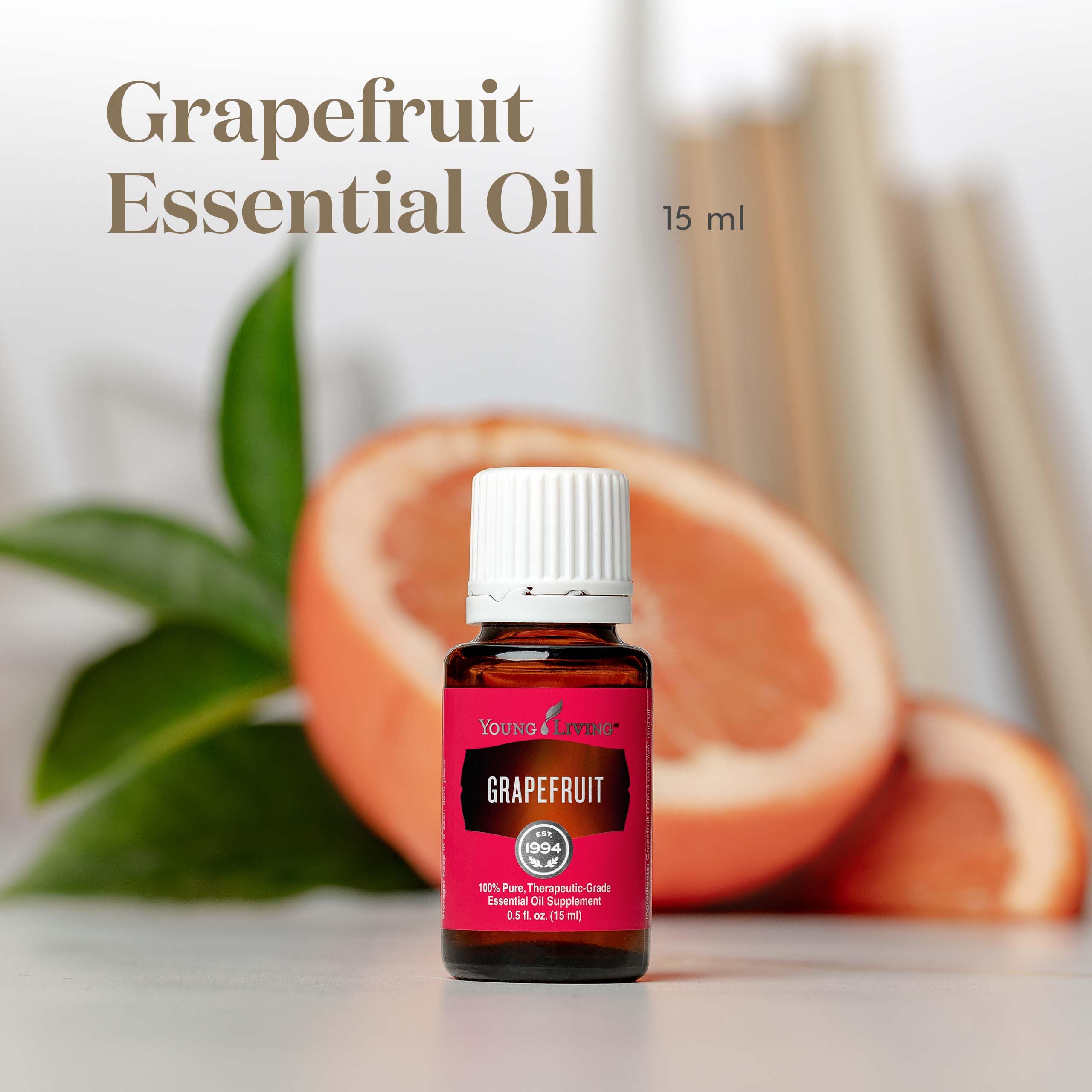 Difusor con aceite de pomelo de Young Living, aroma cítrico revitalizante.