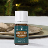 Young Living Northern Black Spruce mezcla en crema para piel suave y cabello brillante.