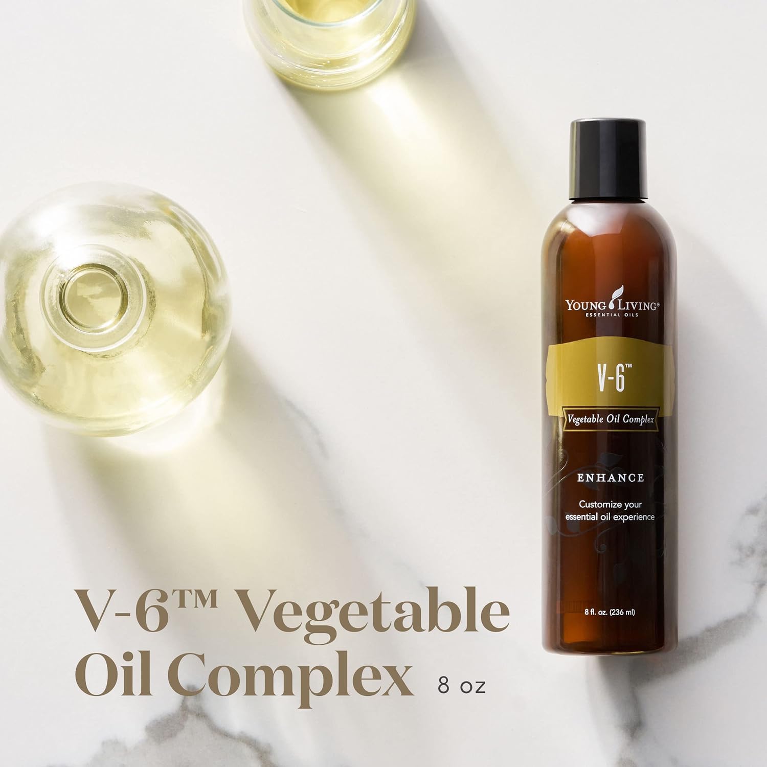 Young Living V-6, gotero mostrado, ideal como aceite portador.